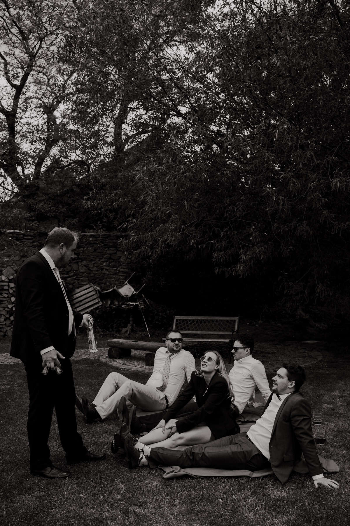 Wedding entertainment - a snapshot of wedding guests relaxing in the grass.