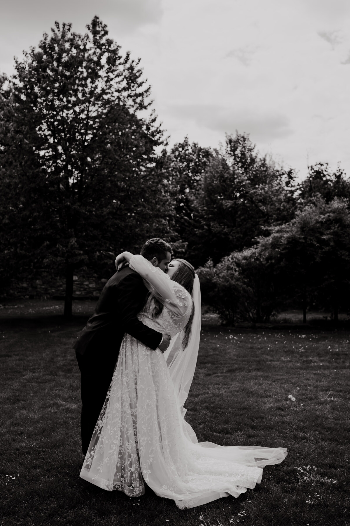 Doubravník - The bride and groom kiss during a wedding photo shoot.
