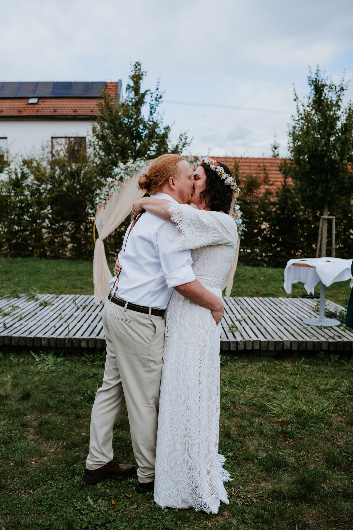 The newlyweds exchange their first kiss.