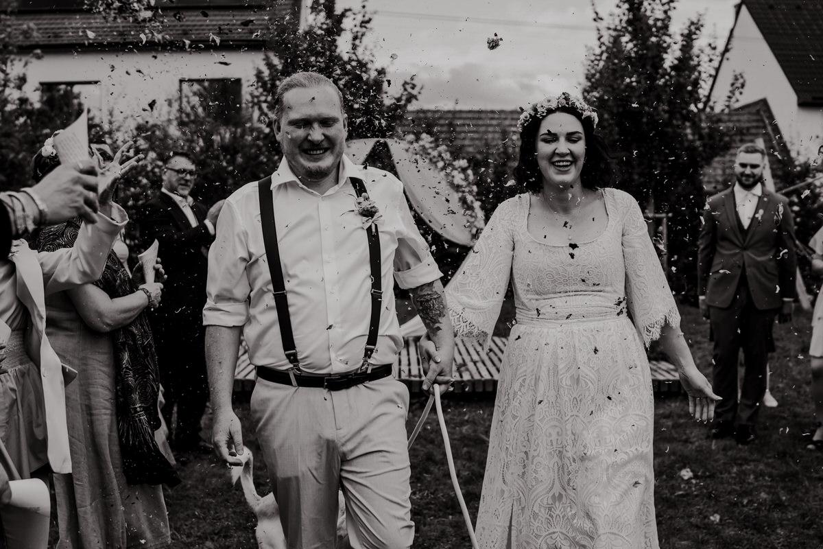 Wedding in Brno, Newlyweds walking down the altar