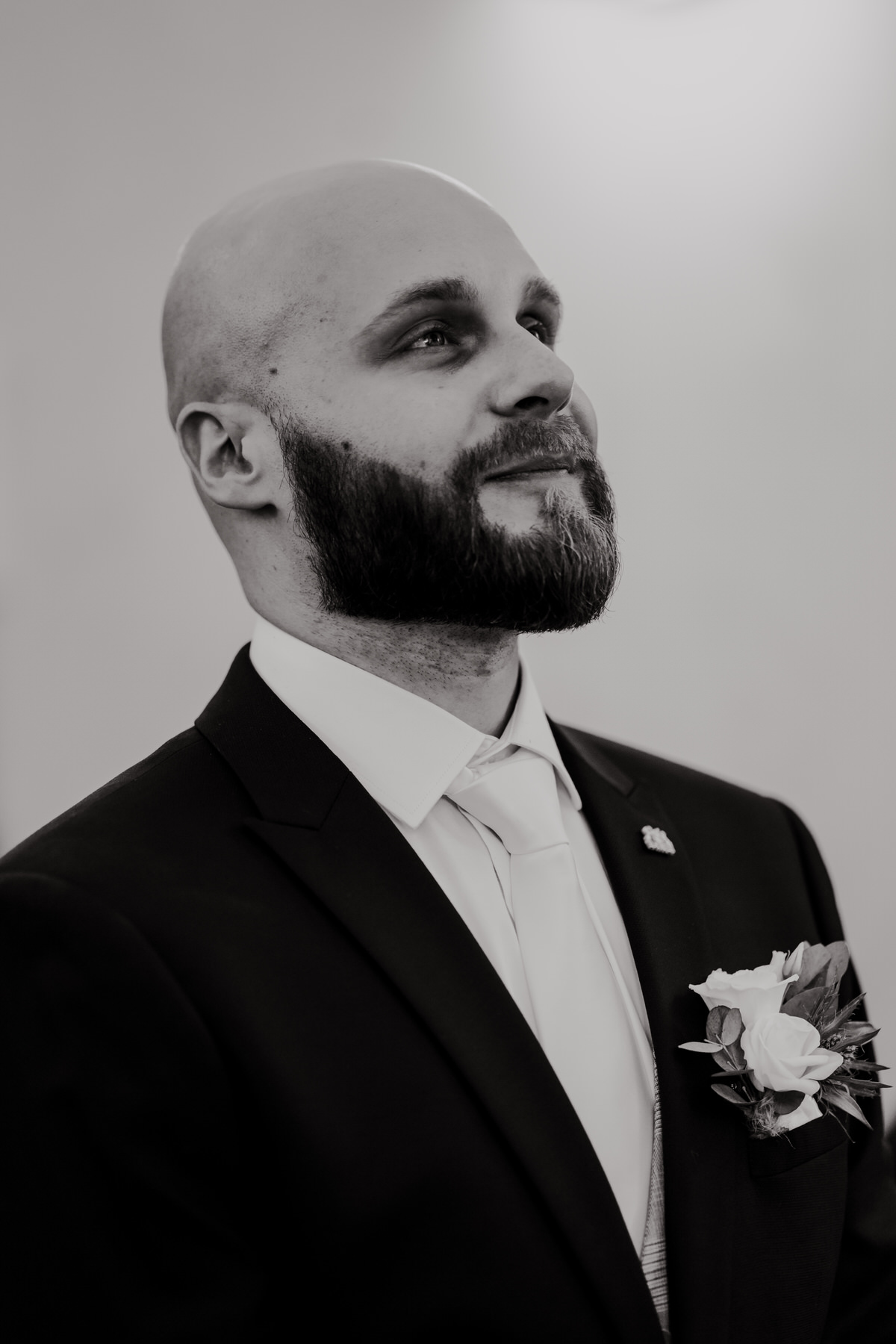 Portrait of the groom during the wedding ceremony.