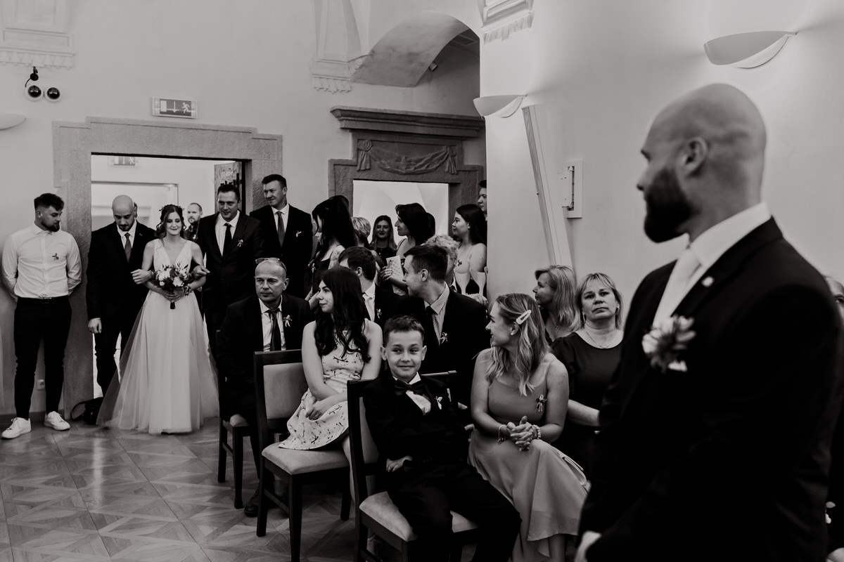 The brothers lead the bride to the altar.