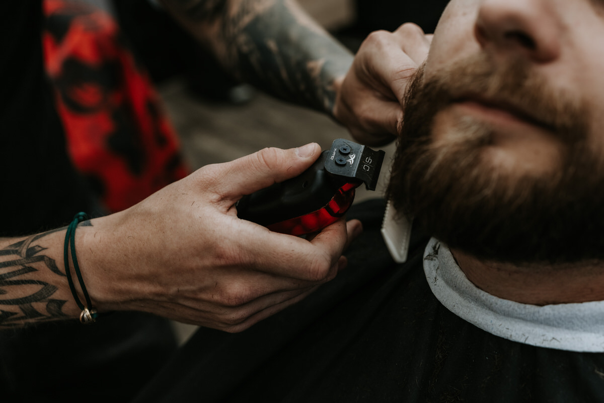 Groom's beard being trimmed by a barber Hradec Králové.