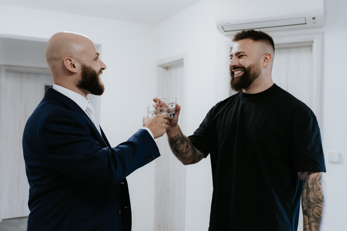 The groom toasts with his best man.