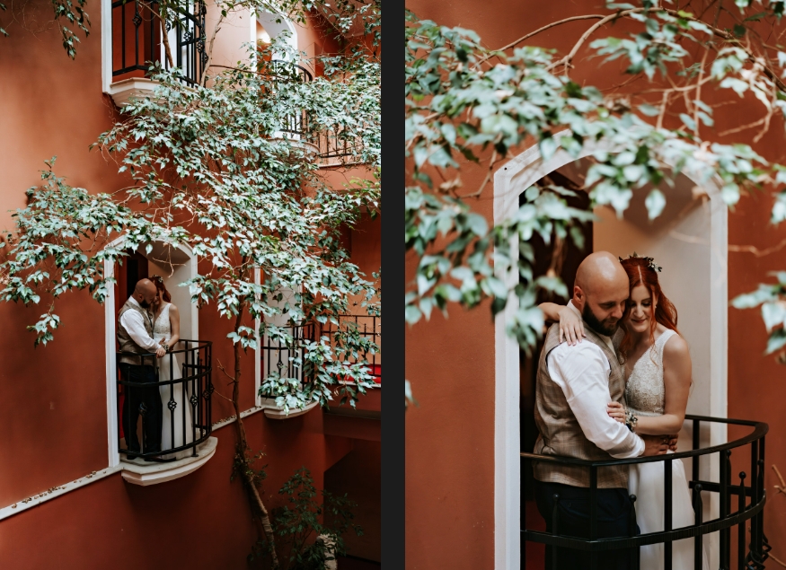 Newlyweds standing on the balcony.